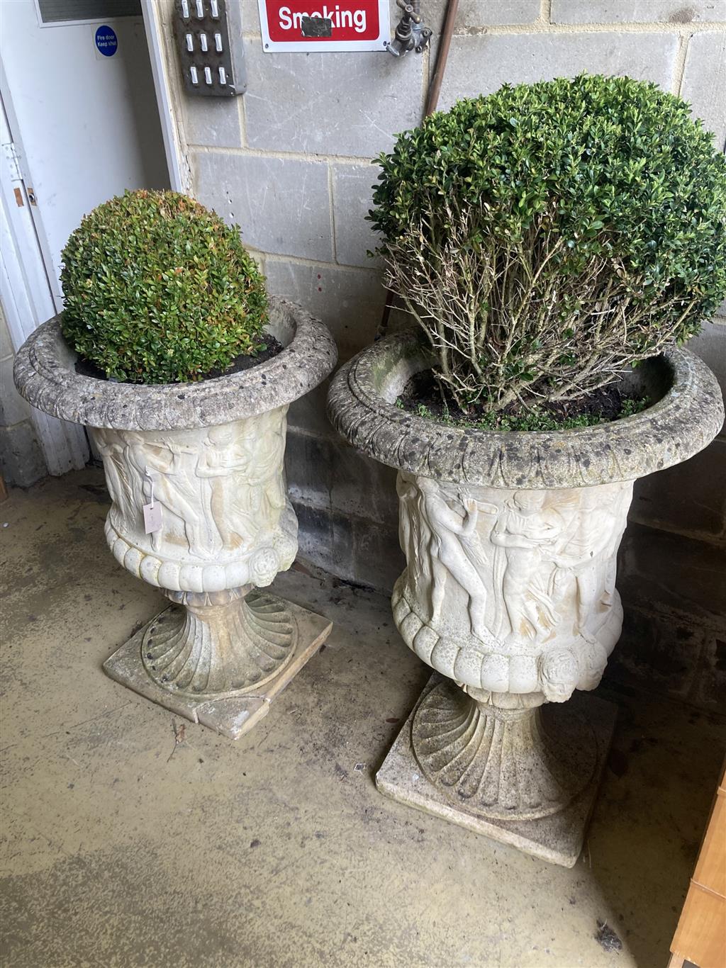 A pair of reconstituted stone campana shaped garden urns, diameter 60cm, height 90cm